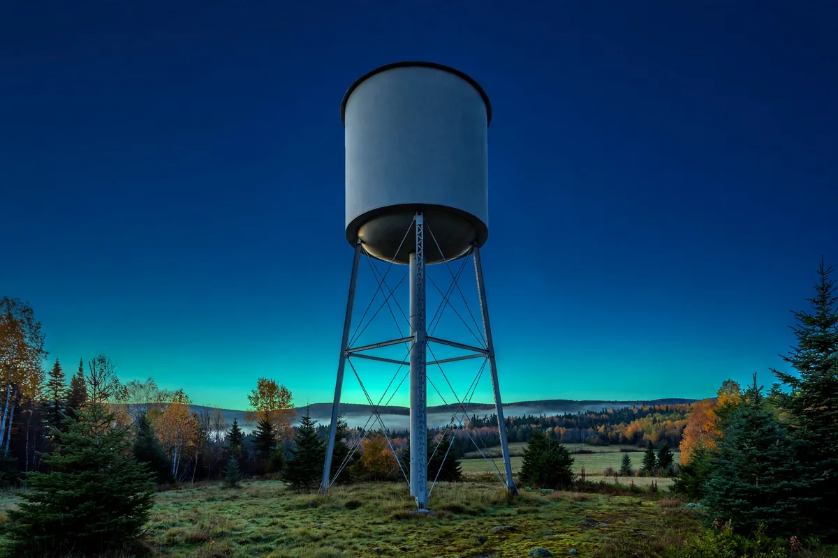 A water tower at dusk